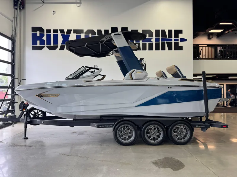 Slide: The Image of 2022 Nautique Super Air Nautique G23 Paragon boat on trailer at Buxton Marine showroom. - 5