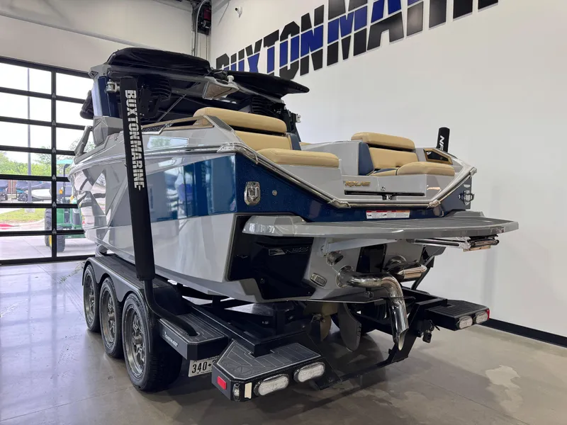 Slide: The Image of 2022 Nautique Super Air Nautique G23 Paragon boat on trailer in showroom. - 6