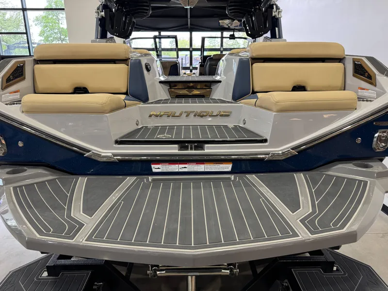Slide: The Image of 2022 Nautique Super Air Nautique G23 Paragon boat with beige seating and sleek design. - 9