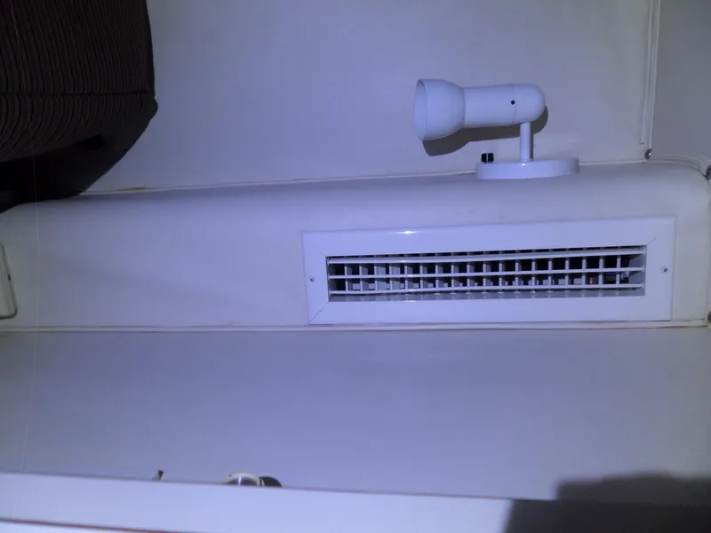 Slide: The Image of Interior of 1988 Hatteras 38 Convertible with air vent and light fixture. - 19