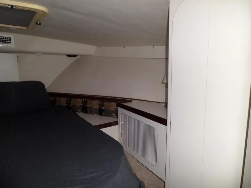 Slide: The Image of 1988 Hatteras 38 Convertible cabin interior with bed and storage. - 20