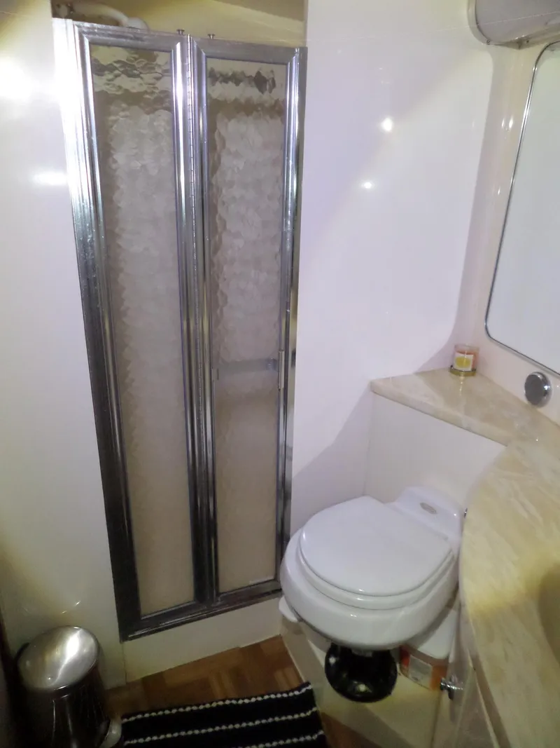 Slide: The Image of Bathroom interior of 1988 Hatteras 38 Convertible yacht with shower and toilet. - 26