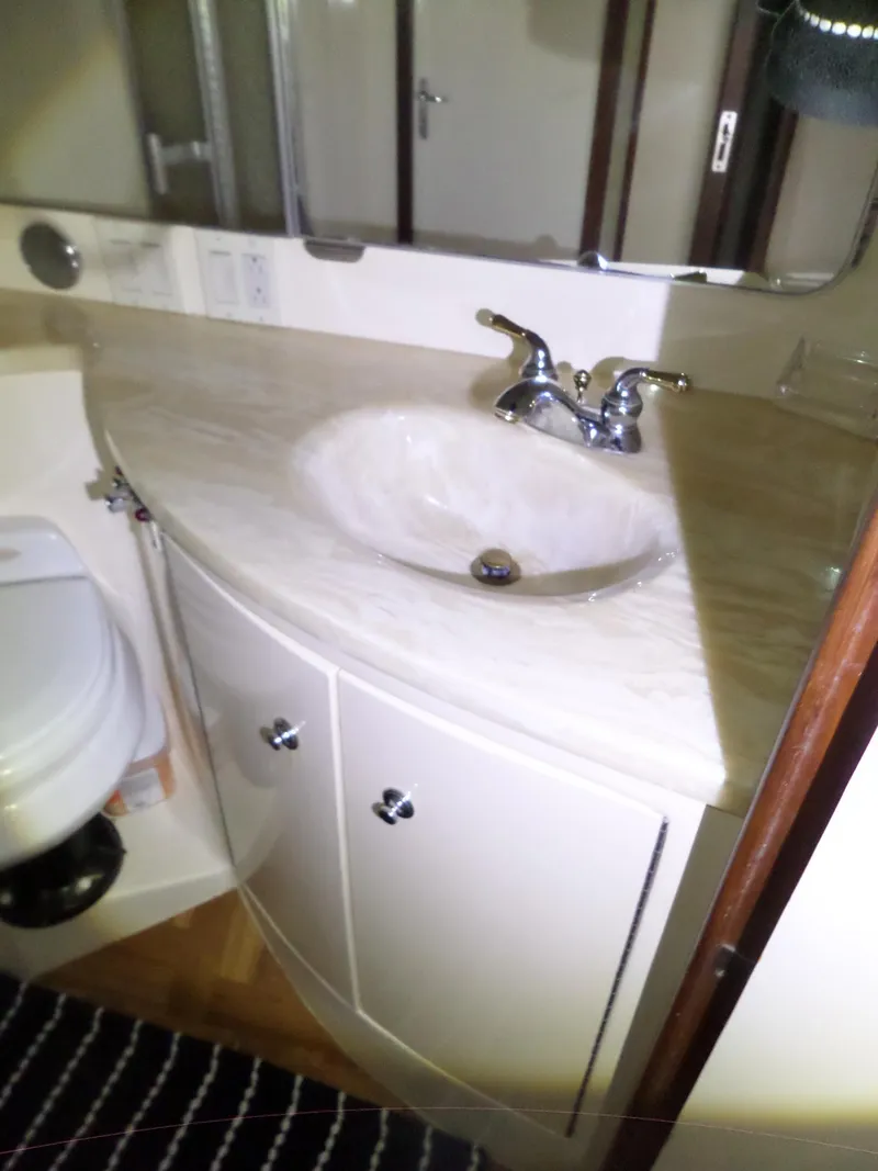Slide: The Image of Bathroom sink and toilet in 1988 Hatteras 38 Convertible yacht. - 27