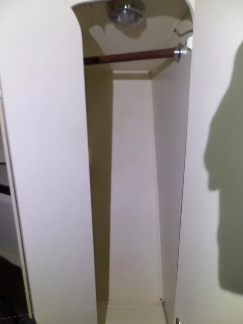 Slide: The Image of Empty closet inside 1988 Hatteras 38 Convertible boat. - 29