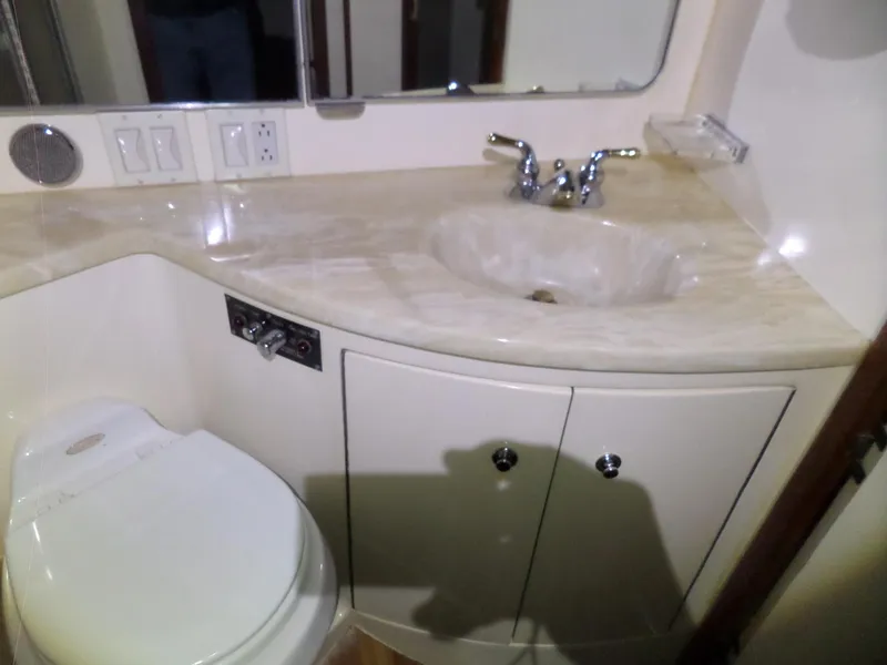 Slide: The Image of 1988 Hatteras 38 Convertible yacht bathroom with sink and toilet. - 31
