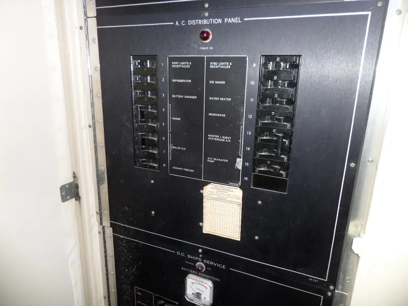 Slide: The Image of Electrical distribution panel on a 1988 Hatteras 38 Convertible boat. - 33