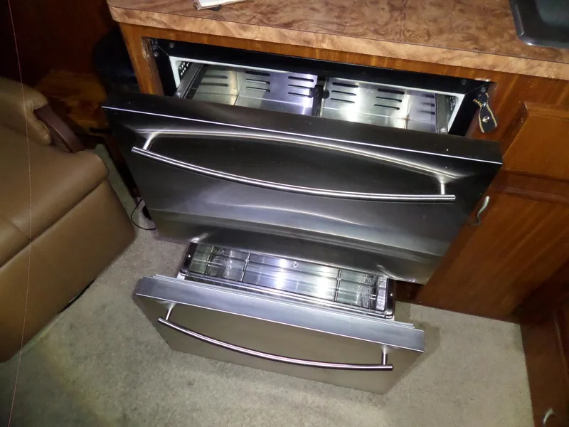 Slide: The Image of Stainless steel double drawer dishwasher in a 1988 Hatteras 38 Convertible yacht kitchen. - 35
