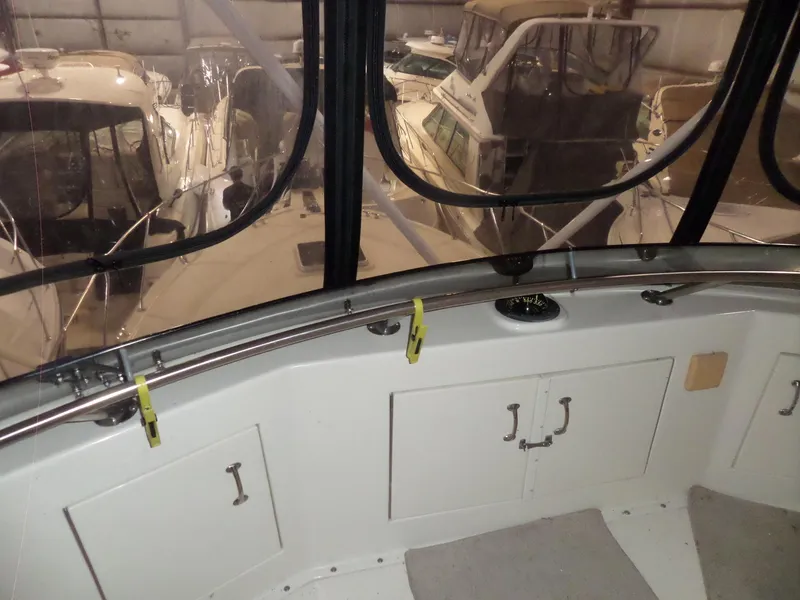 Slide: The Image of 1988 Hatteras 38 Convertible interior view with boats in storage. - 45