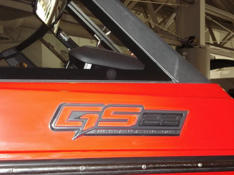 Slide: The Image of 2023 Nautique Super Air Nautique GS22 logo on red boat exterior. - 13