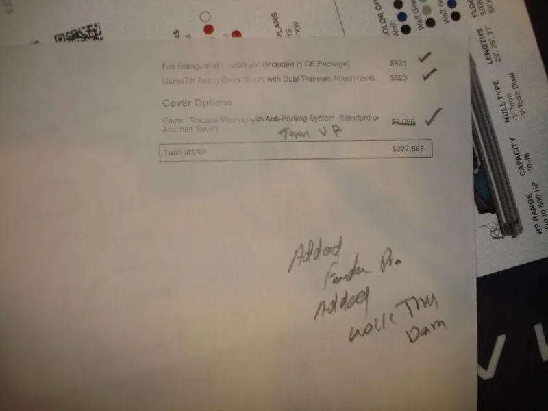 Slide: The Image of 2023 Nautique Super Air Nautique GS22 document with handwritten notes and pricing details. - 15