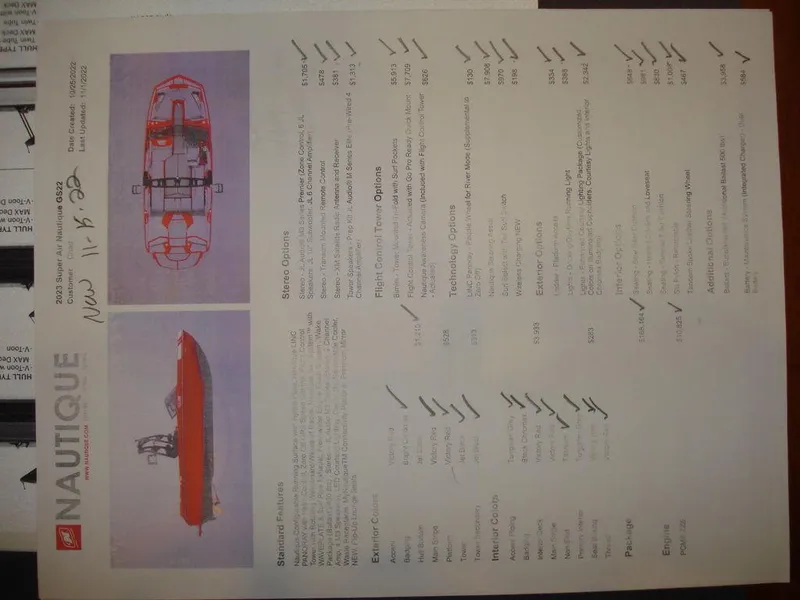 Slide: The Image of 2023 Nautique Super Air Nautique GS22 specifications sheet with boat diagrams and features list. - 16