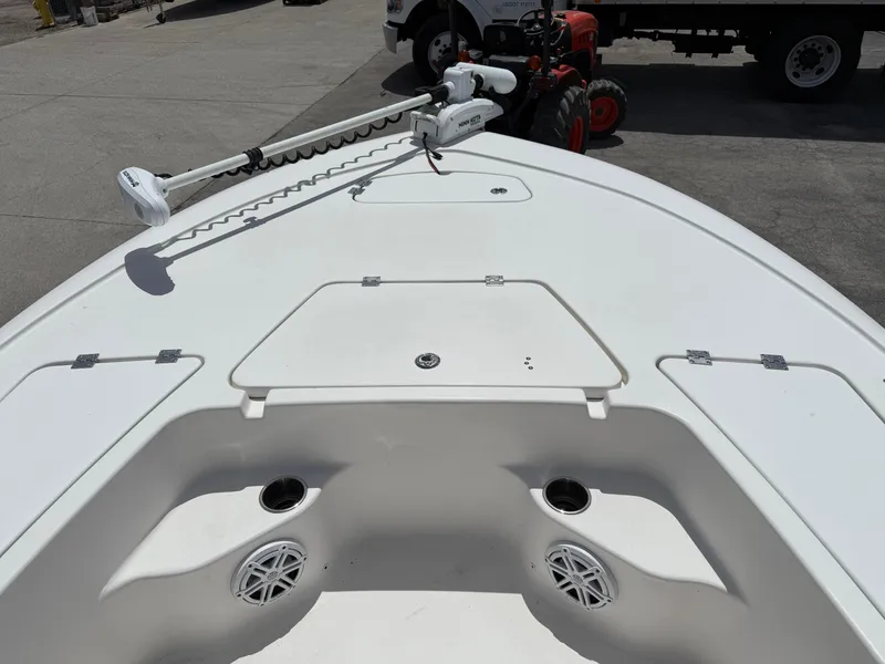 Slide: The Image of 2022 Tidewater 1910 Bay Max boat deck with storage compartments and trolling motor. - 13