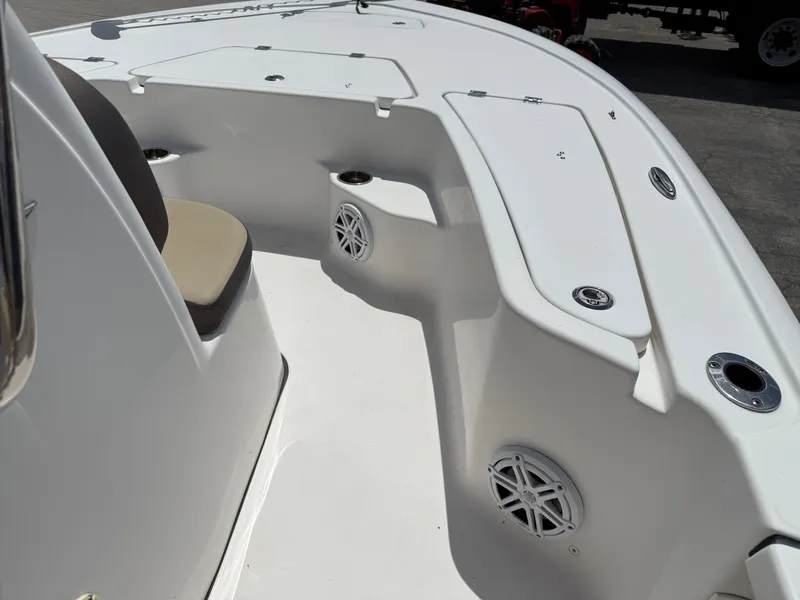 Slide: The Image of 2022 Tidewater 1910 Bay Max boat interior with seating and storage compartments. - 14