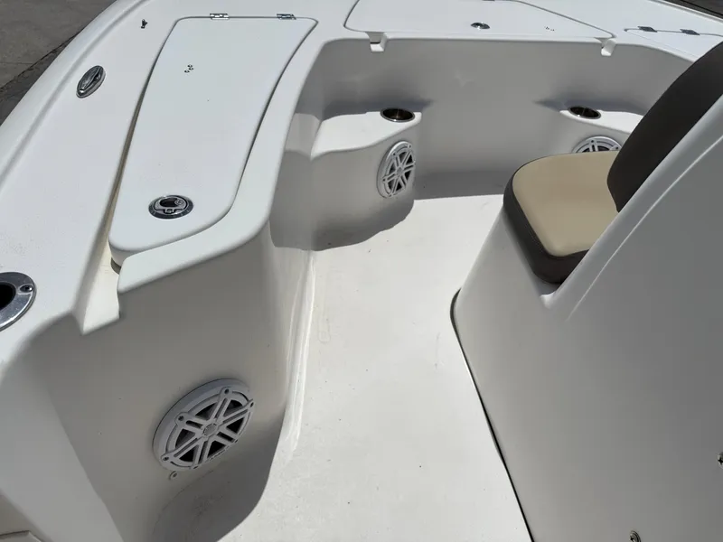 Slide: The Image of 2022 Tidewater 1910 Bay Max boat interior with seating and speaker system. - 17