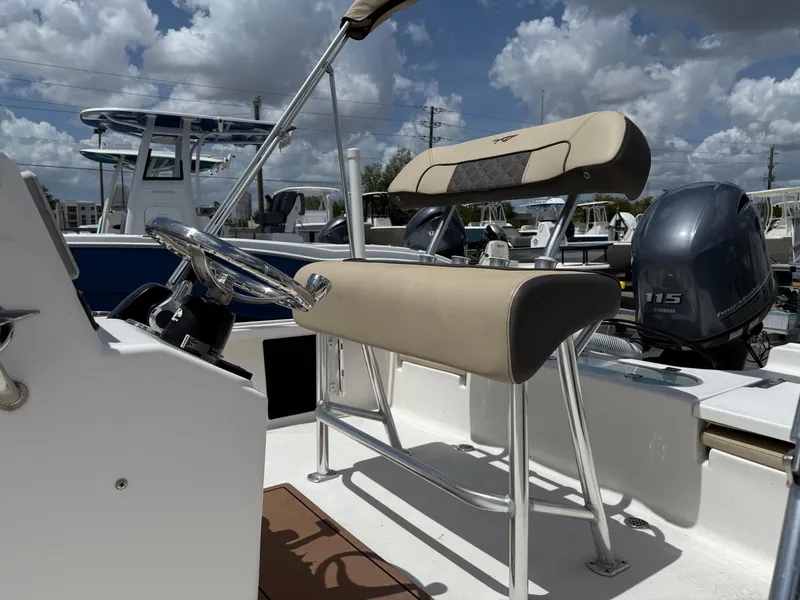 Slide: The Image of 2022 Tidewater 1910 Bay Max boat on trailer under cloudy sky. - 2