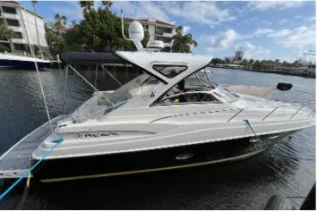 The Image of 2007 Regal Commodore 3760 IB yacht docked in a serene marina setting. - 1