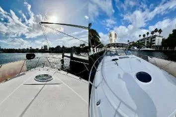 Slide: The Image of 2007 Regal Commodore 3760 IB yacht docked under a sunny, blue sky. - 2