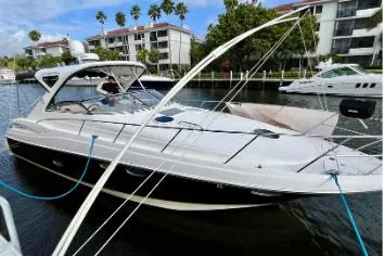 Slide: The Image of 2007 Regal Commodore 3760 IB yacht docked near waterfront apartments. - 20