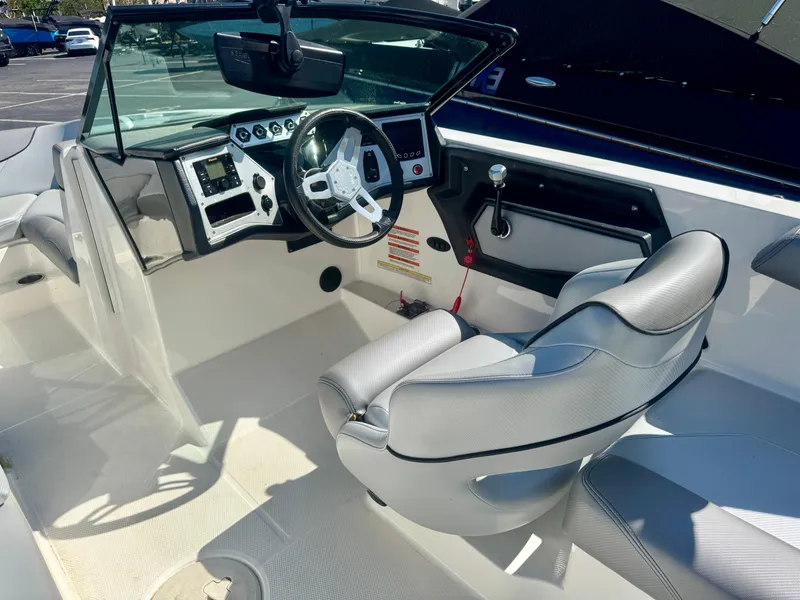 Slide: The Image of 2018 MasterCraft NXT22 boat interior with modern dashboard and steering wheel. - 6