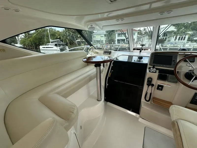 Slide: The Image of 2008 Tiara Yachts 3500 Sovran interior with luxurious seating and modern helm controls. - 3