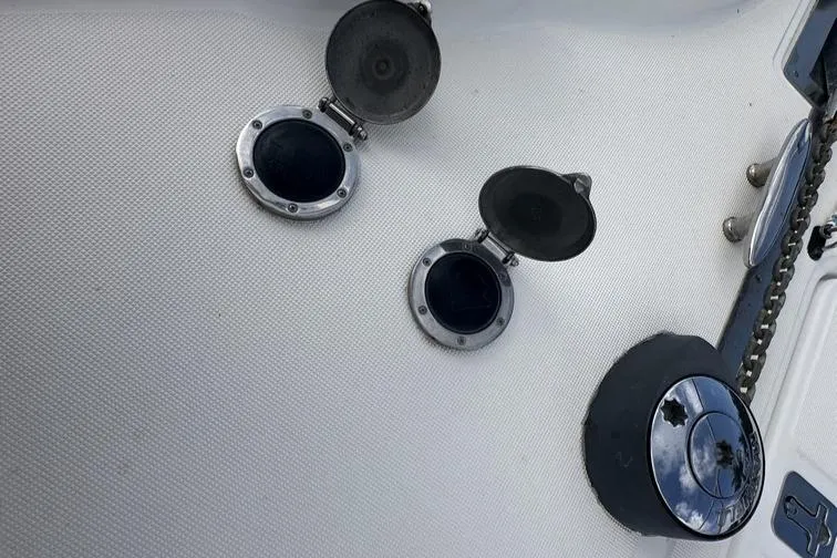 Slide: The Image of 2008 Tiara Yachts 3500 Sovran deck with open hatches and chain detail. - 37