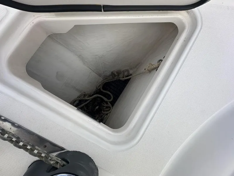 Slide: The Image of Anchor locker of 2008 Tiara Yachts 3500 Sovran with chain and rope. - 39