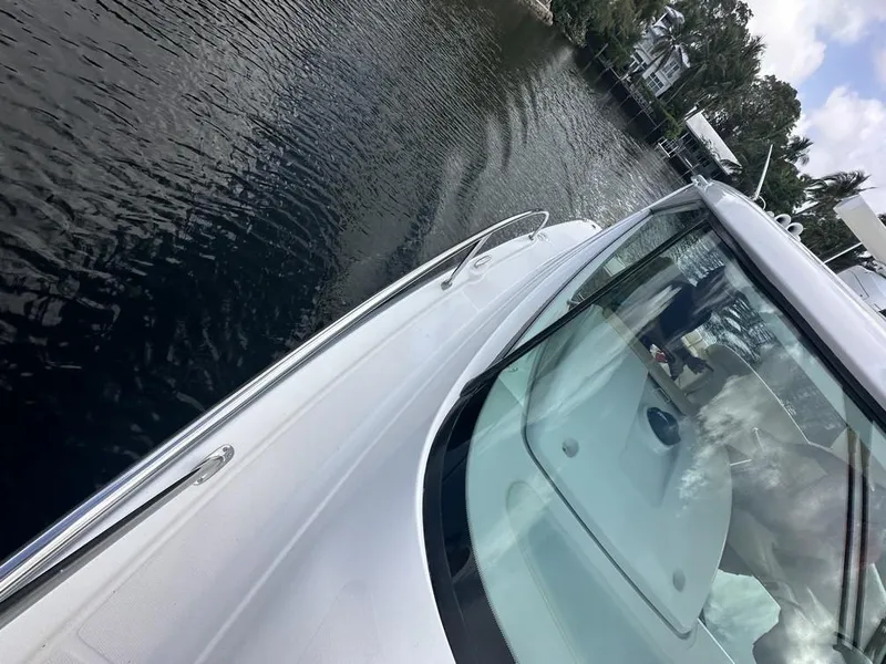 Slide: The Image of 2008 Tiara Yachts 3500 Sovran cruising on calm waters near a shoreline. - 40