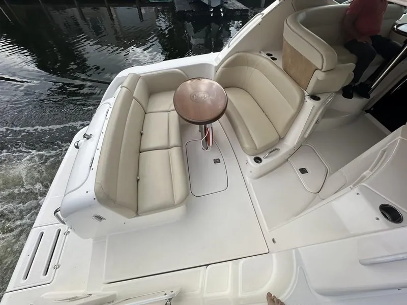 Slide: The Image of 2008 Tiara Yachts 3500 Sovran boat with spacious seating and round table on deck. - 45