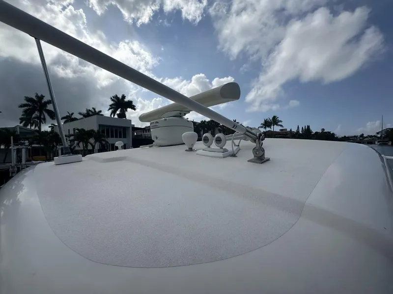 Slide: The Image of 2008 Tiara Yachts 3500 Sovran deck with radar, under a partly cloudy sky. - 46