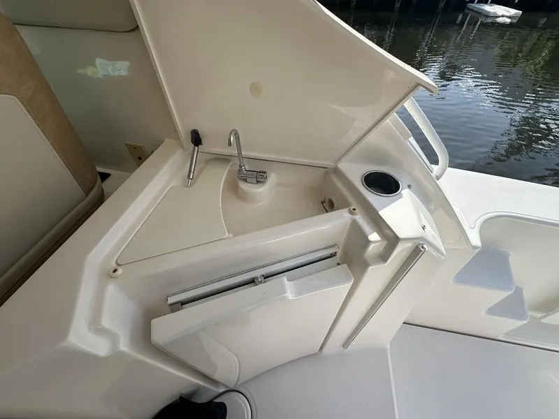Slide: The Image of 2008 Tiara Yachts 3500 Sovran cockpit sink and storage area. - 9