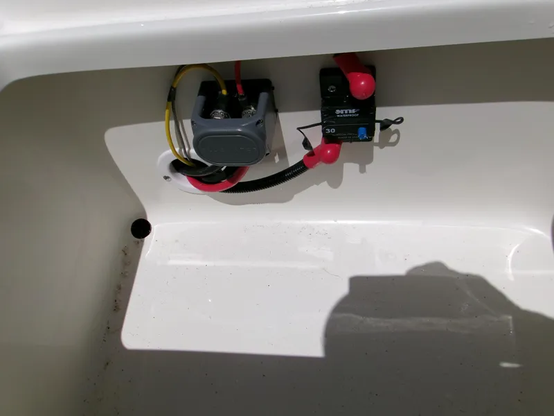 Slide: The Image of Electrical components inside a 2025 Key West 1720 boat compartment. - 10