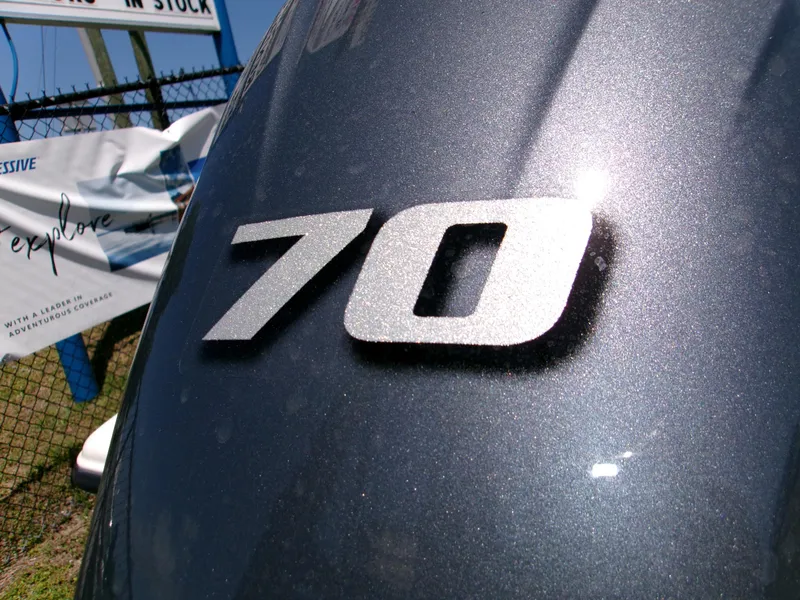 Slide: The Image of Close-up of '70' emblem on 2025 Key West 1720 boat, metallic finish. - 11