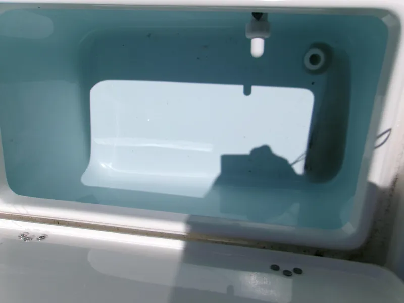 Slide: The Image of Interior view of a 2025 Key West 1720 boat compartment with water inside. - 12