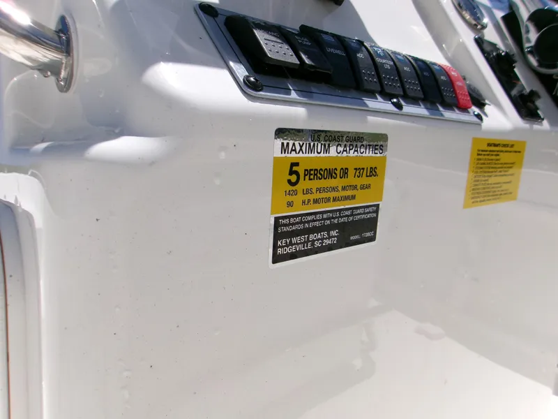 Slide: The Image of 2025 Key West 1720 boat capacity label, indicating a maximum of 5 persons or 737 lbs. - 14