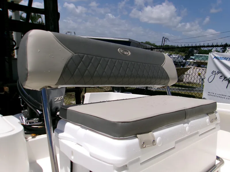 Slide: The Image of 2025 Key West 1720 boat seat with gray and white cushioned design under a sunny sky. - 8