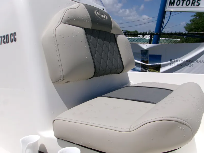 Slide: The Image of 2025 Key West 1720 boat seat with gray and beige upholstery, outdoor setting. - 9