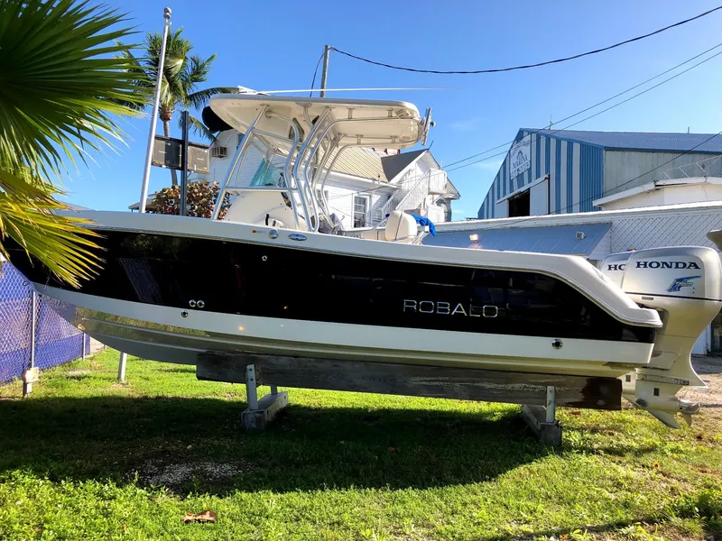 Slide: The Image of 2007 Robalo R240 Center Console boat on display outdoors. - 1