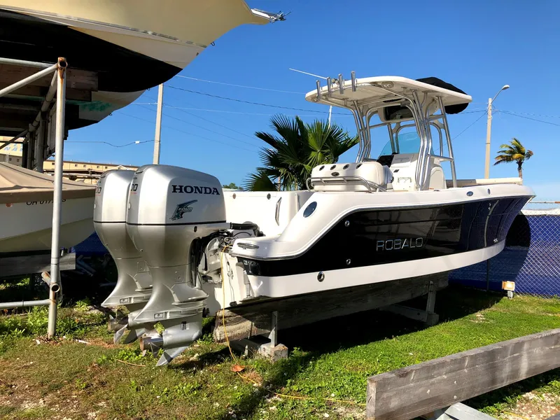 Slide: The Image of 2007 Robalo R240 Center Console boat with Honda outboard motor on display. - 3