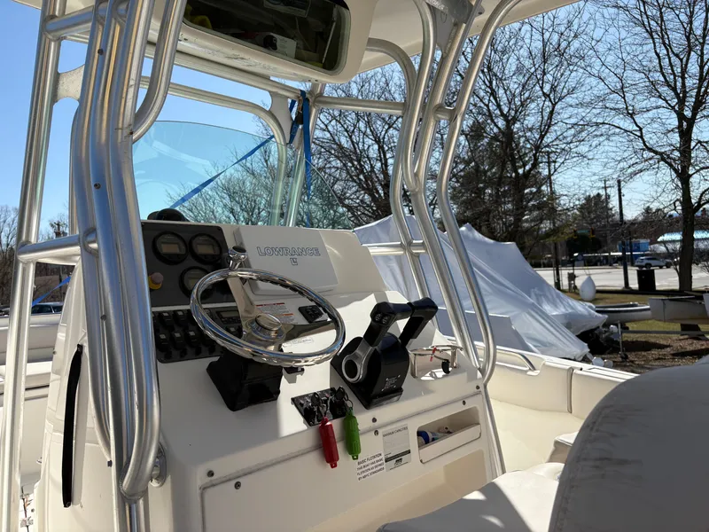 Slide: The Image of 2007 Robalo R240 Center Console boat interior with steering wheel and controls. - 7