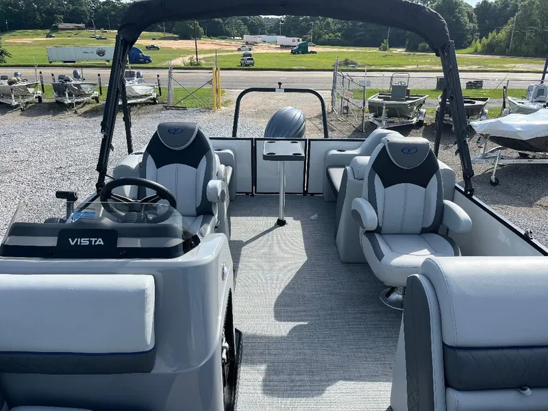 Slide: The Image of 2025 Veranda VS22RC pontoon boat with modern seating and steering console. - 11