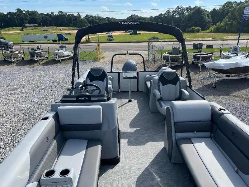 Slide: The Image of 2025 Veranda VS22RC pontoon boat with spacious seating and modern design, displayed outdoors. - 13