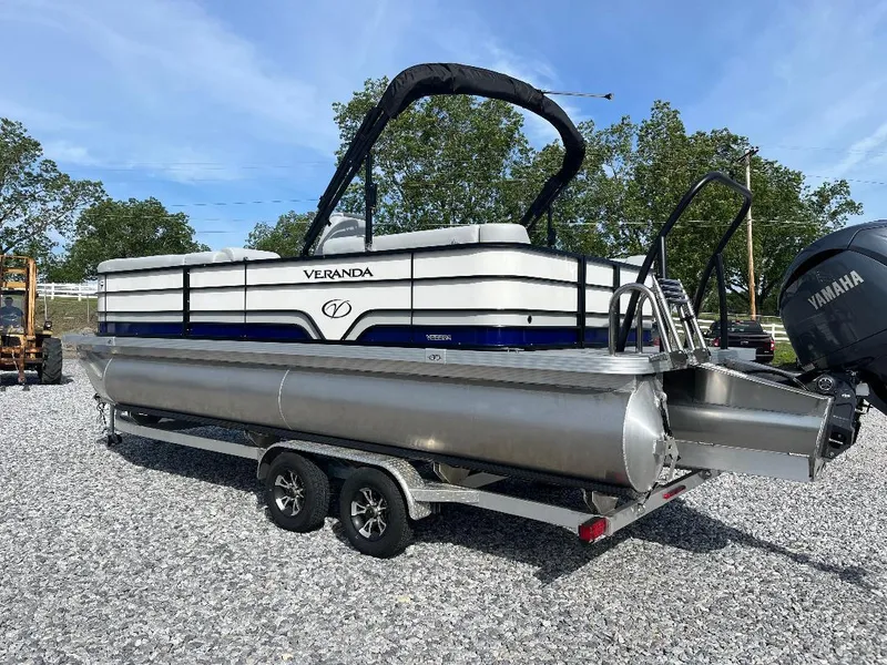 Slide: The Image of 2025 Veranda VS22RC pontoon boat on trailer, parked outdoors. - 3