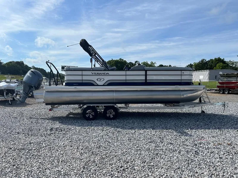 Slide: The Image of 2025 Veranda VS22RC pontoon boat on a gravel lot under a clear sky. - 6