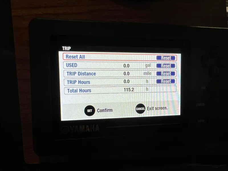 Slide: The Image of Yamaha trip display showing reset options and total hours for 2023 Ranger Tugs R-25. - 18