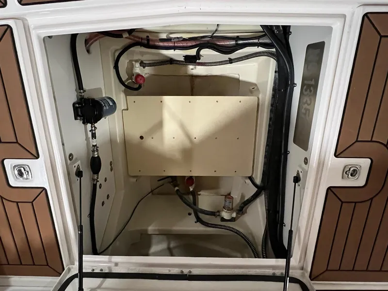 Slide: The Image of 2023 Ranger Tugs R-25 engine compartment with wiring and components. - 6