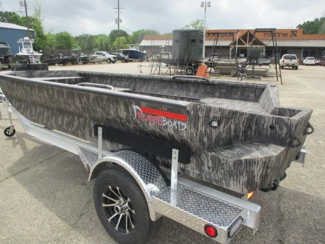 Slide: The Image of 2025 Reaper Boats 656-1382 model on trailer, parked outdoors. - 3