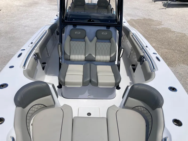Slide: The Image of 2025 Key West 291FS boat interior with gray seating and modern design. - 17