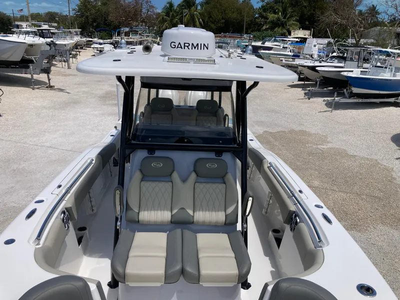 Slide: The Image of 2025 Key West 291FS boat with Garmin equipment, featuring spacious seating and sleek design. - 18