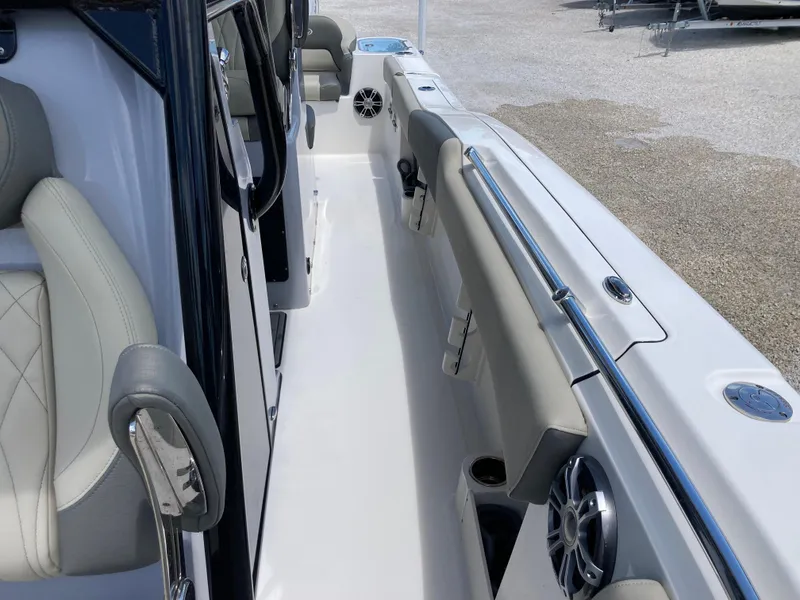 Slide: The Image of 2025 Key West 291FS boat interior with cushioned seating and sleek design. - 20