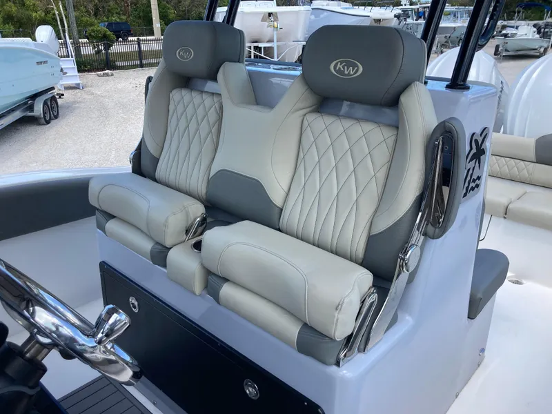 Slide: The Image of 2025 Key West 291FS boat seats with quilted upholstery and armrests. - 21
